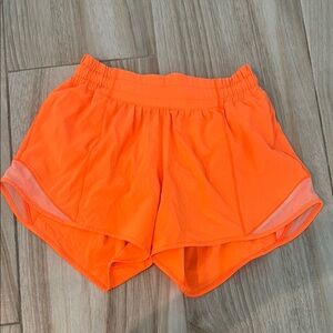 lululemon athletica Bright Orange Hotty Hot 4" shorts